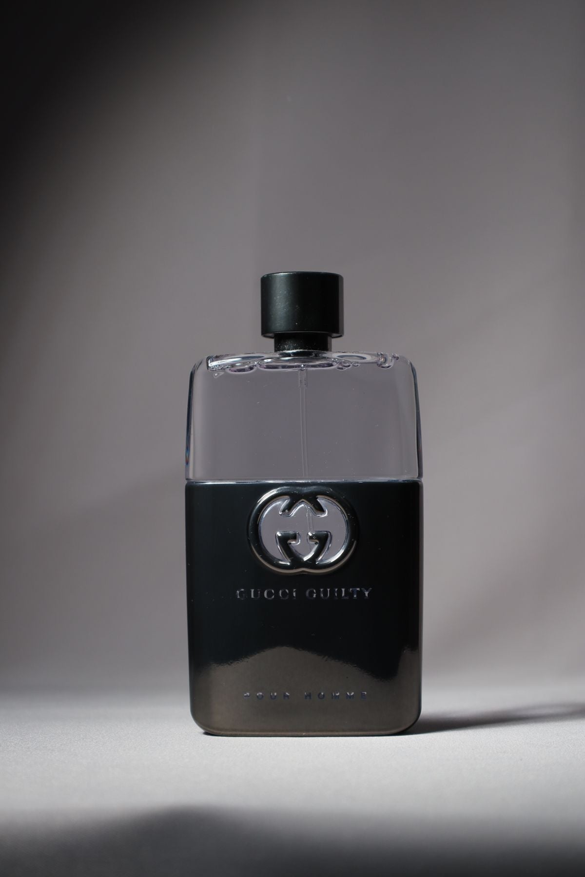 Black Gucci Guilty perfume bottle shown from the front