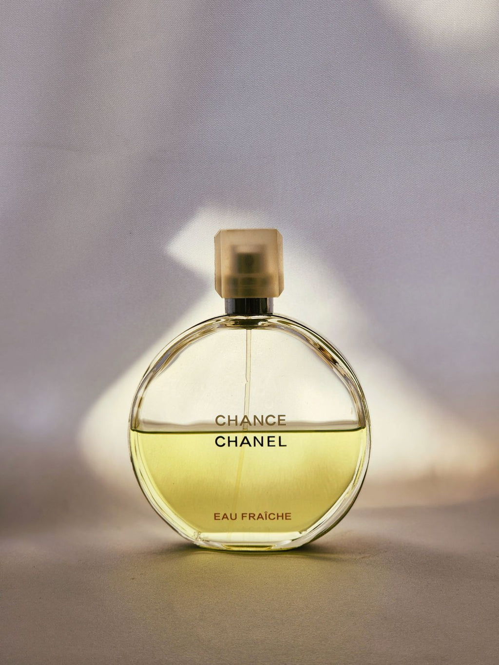Chanel Chance perfume bottle on elegant background
