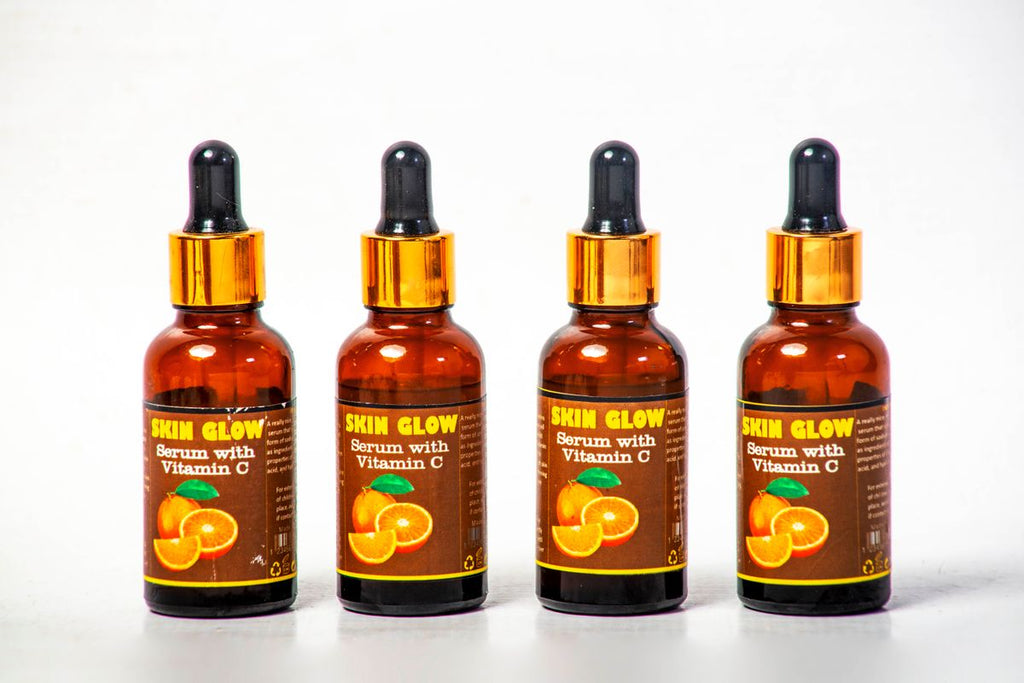 Serum bottles arranged on white background